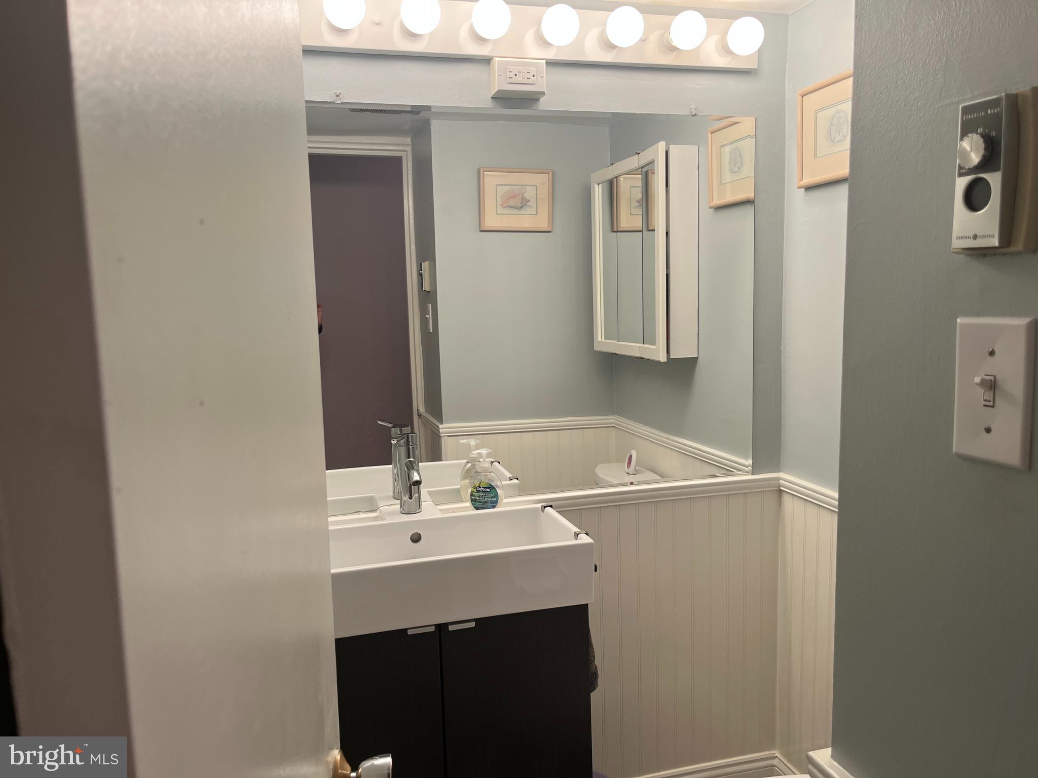 1610 The Fairway, Unit 104W Jenkintown, PA 19046 - Photo 7 of 14 a bathroom with a sink and a mirror