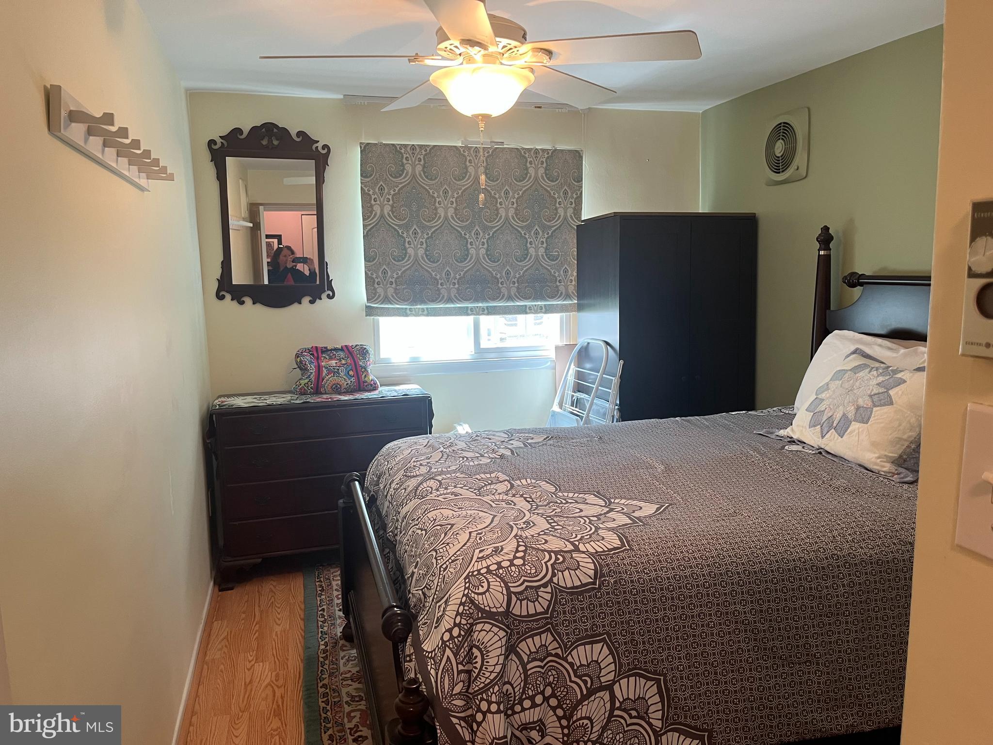 1610 The Fairway, Unit 104W Jenkintown, PA 19046 - Photo 8 of 14 a bedroom with a bed and a window