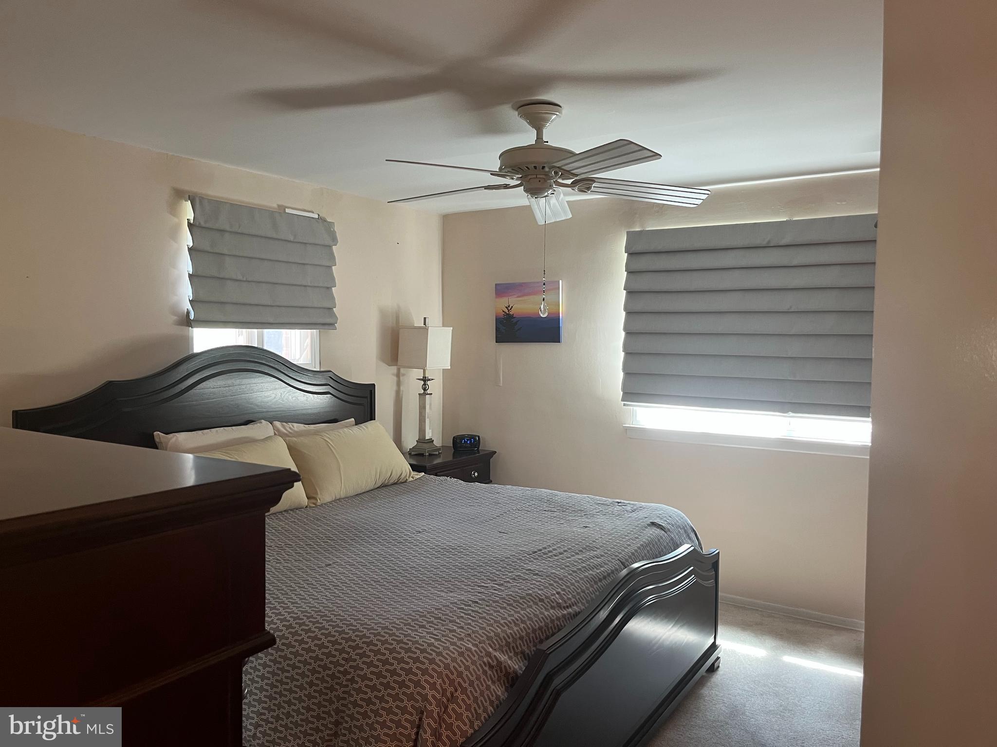 1610 The Fairway, Unit 104W Jenkintown, PA 19046 - Photo 9 of 14 a bedroom with a bed and window