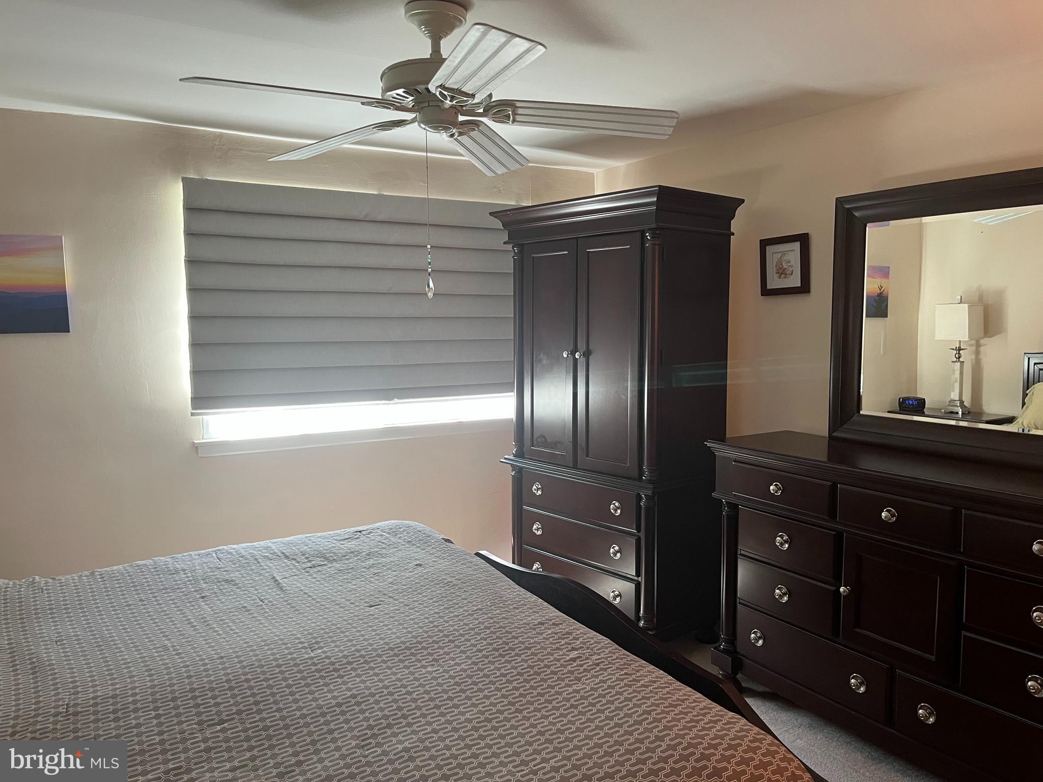 1610 The Fairway, Unit 104W Jenkintown, PA 19046 - Photo 10 of 14 a bedroom with a bed and a dresser