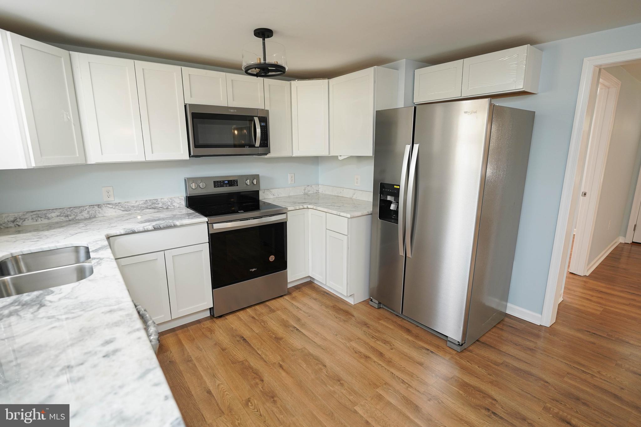 31872 Flower Hill Church Road Eden, MD 21822 - Photo 11 of 28 a kitchen with a refrigerator sink and microwave