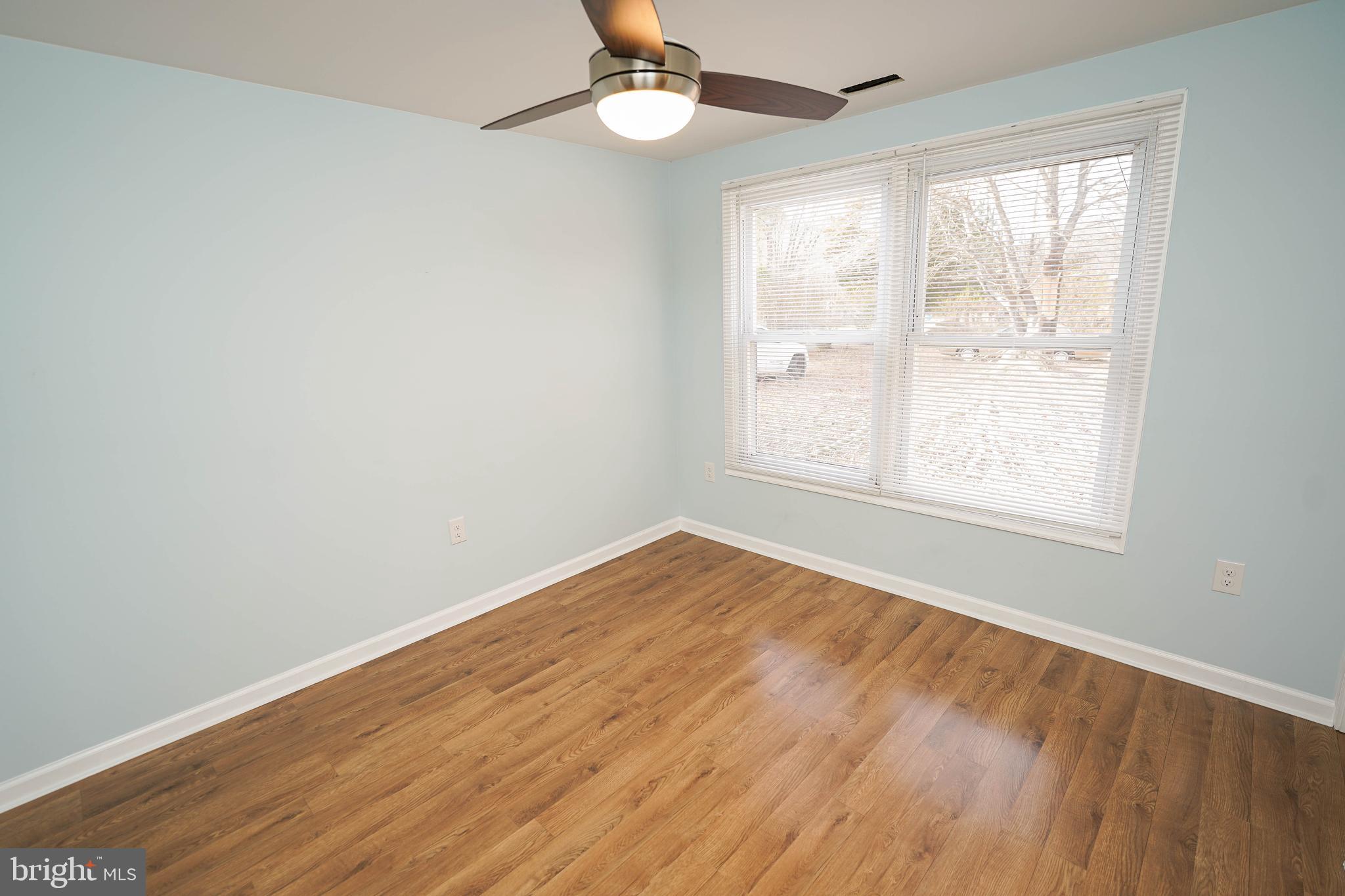 31872 Flower Hill Church Road Eden, MD 21822 - Photo 17 of 28 a view of an empty room with wooden floor and a window