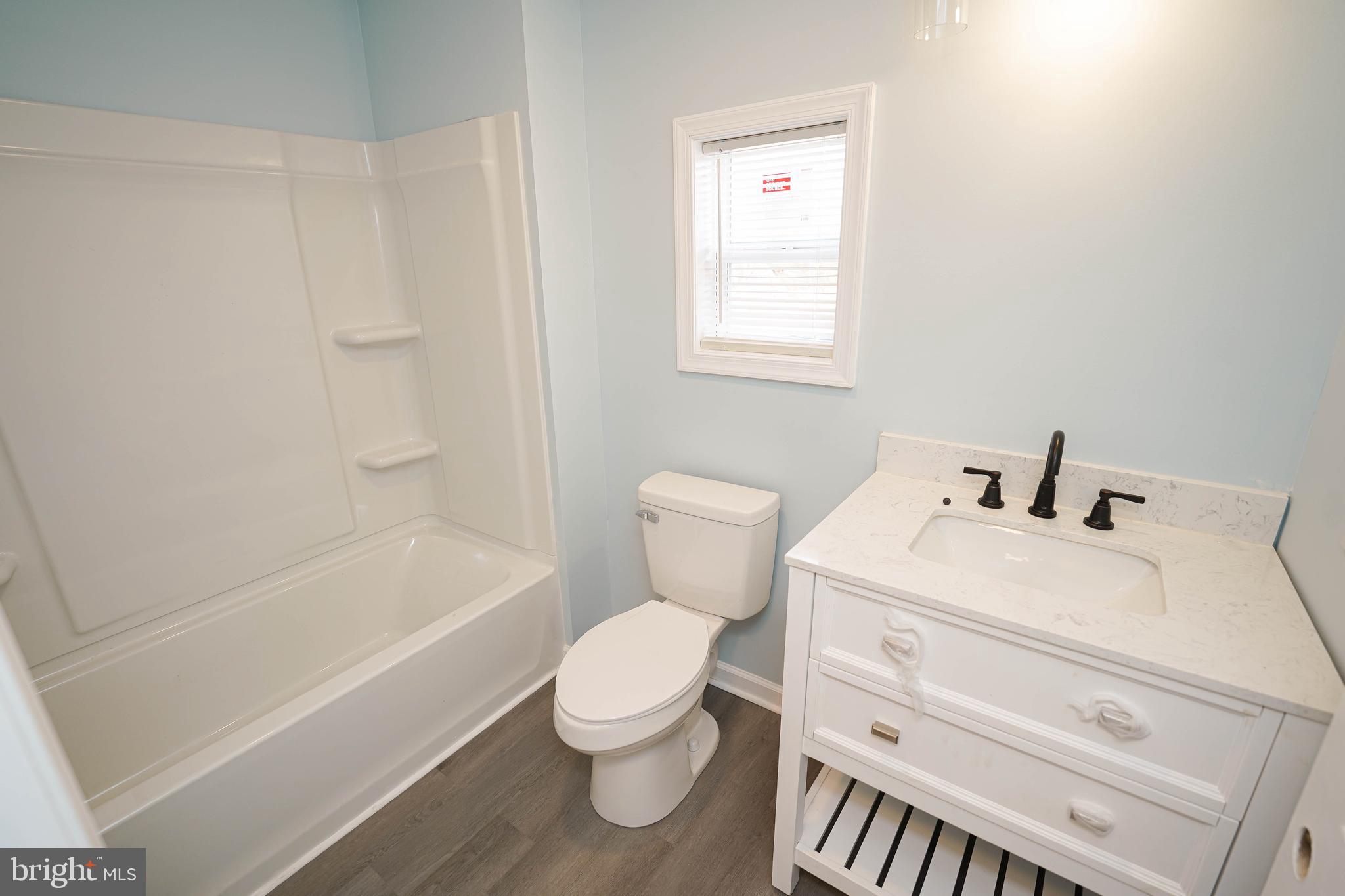 31872 Flower Hill Church Road Eden, MD 21822 - Photo 18 of 28 a bathroom with a sink a toilet and bathtub