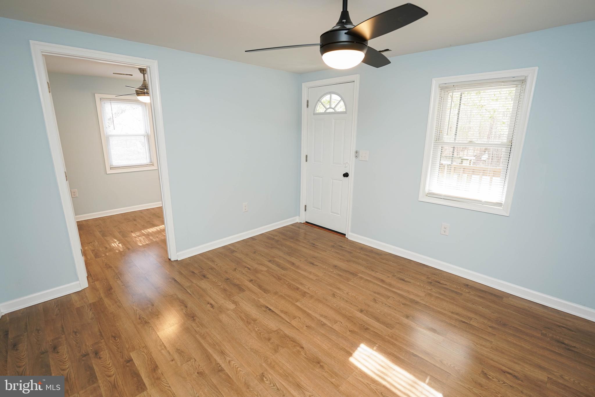 31872 Flower Hill Church Road Eden, MD 21822 - Photo 3 of 28 wooden floor in an empty room with a window