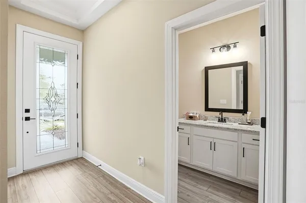 a bathroom with a double vanity sink and a mirror