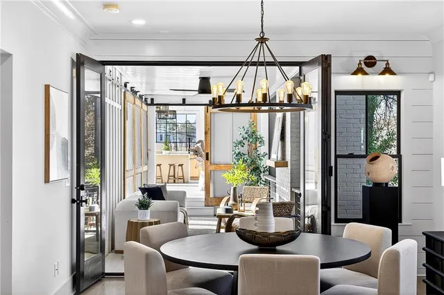 an empty room with wooden floor and a ceiling fan