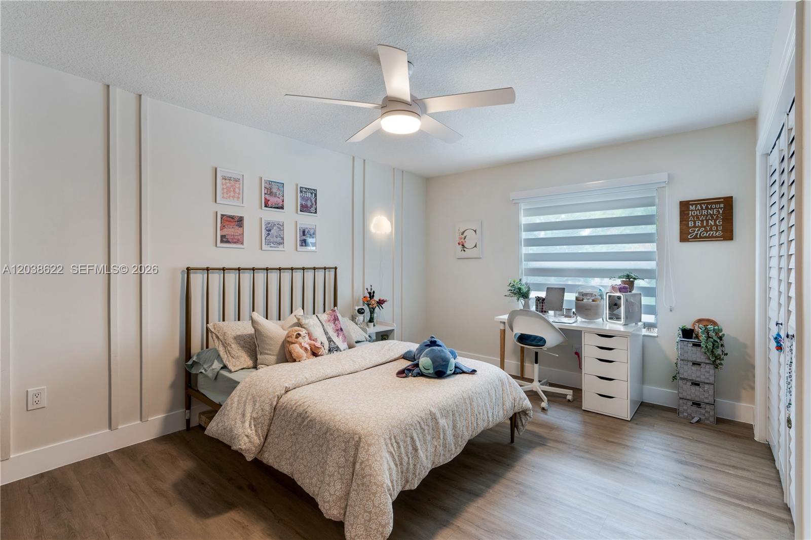 14830 Southwest 149th Street Miami, FL 33196 - Photo 17 of 43 a bedroom with a bed and a window