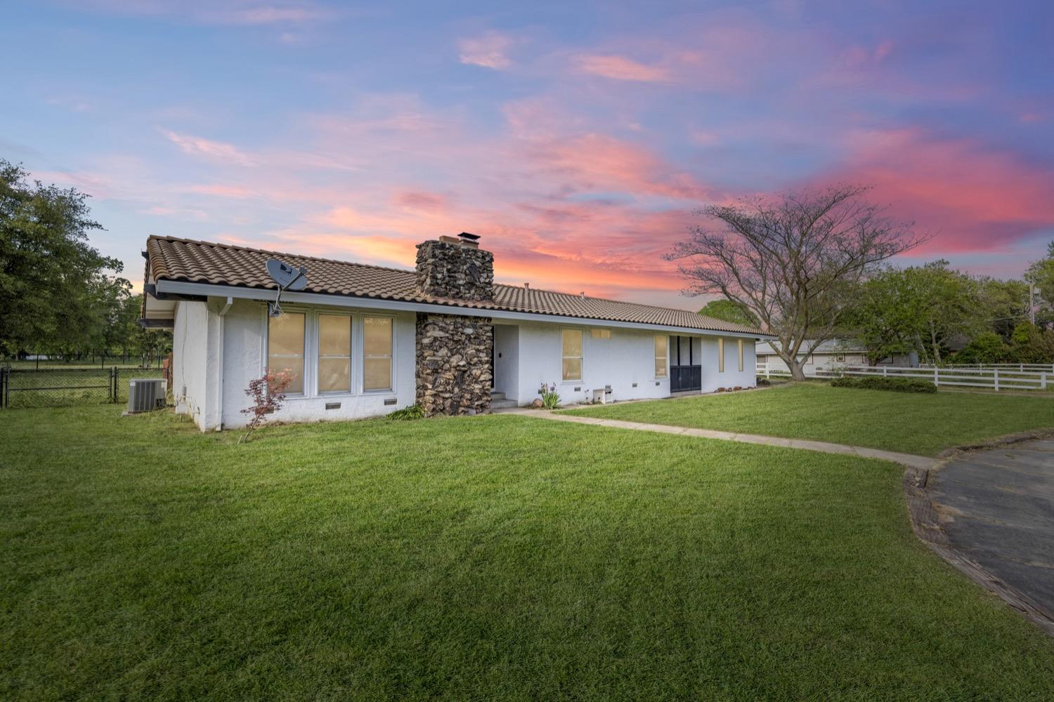 4980 Del Road Loomis, CA 95650 - Photo 1 of 1 a front view of a house with garden