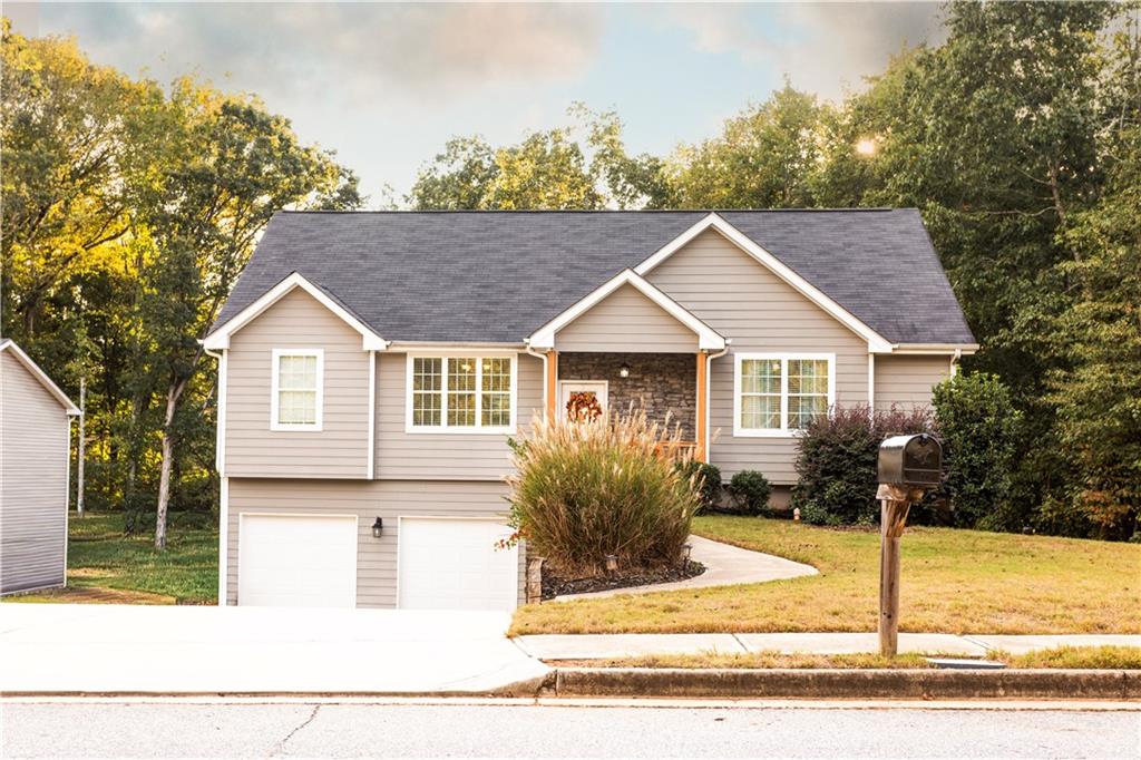 a front view of a house with garden