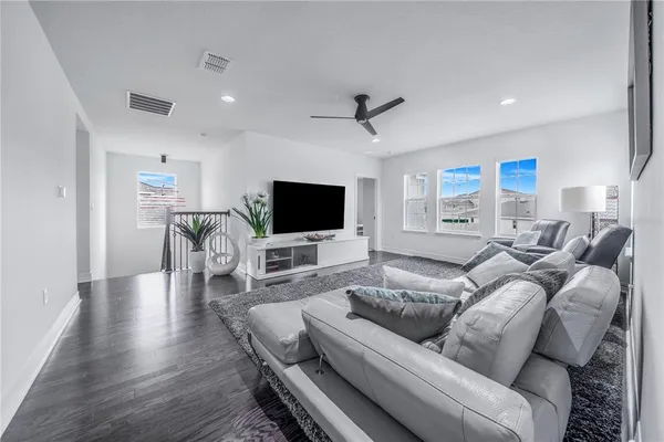 a spacious bedroom with a bed and a couch