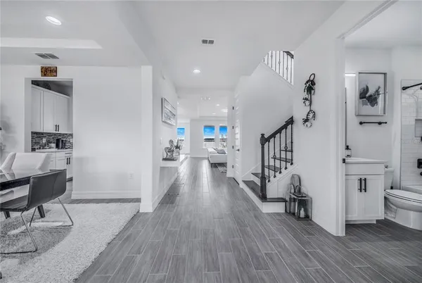 a kitchen with stainless steel appliances kitchen island granite countertop a sink and cabinets
