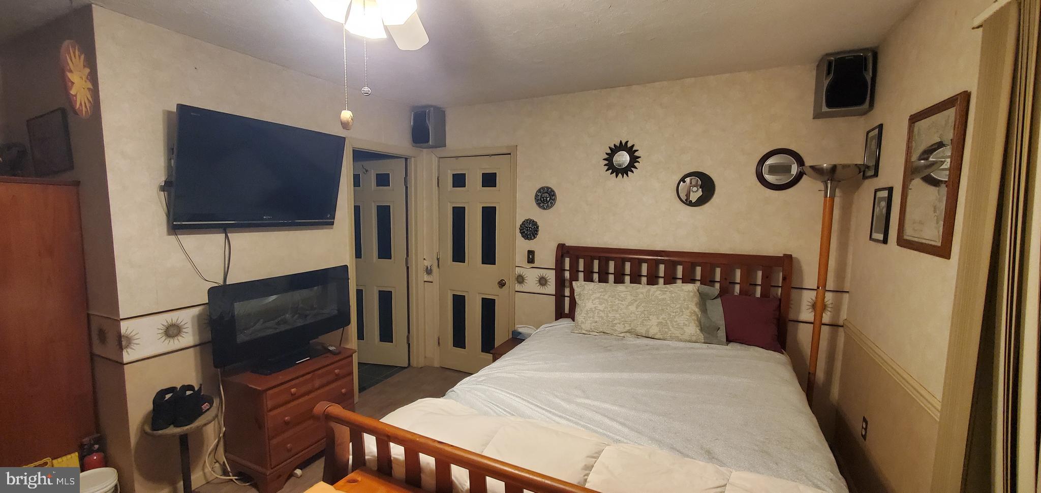 1529 Mt Zion Road Lebanon, PA 17046 - Photo 22 of 24 a bedroom with a bed and a flat screen tv