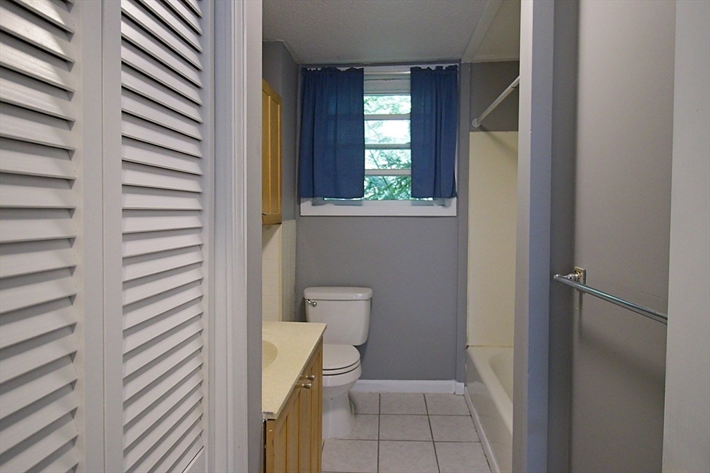 45 Depot Street, Unit 2 Sharon, MA 02067 - Photo 11 of 12 a bathroom with a toilet and a shower