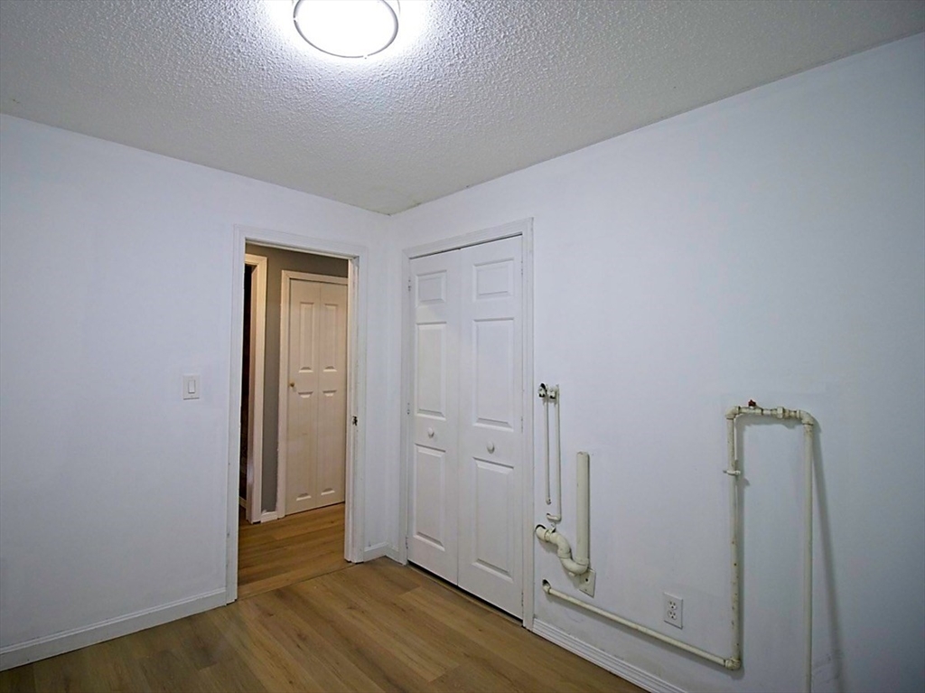 45 Depot Street, Unit 2 Sharon, MA 02067 - Photo 12 of 12 wooden floor in an empty room