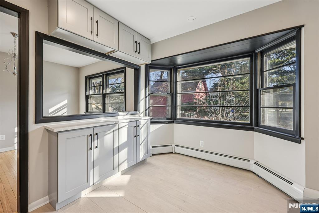217 Knickerbocker Road Closter, NJ 07624 - Photo 12 of 27 a large white cabinet with wide window and cabinets