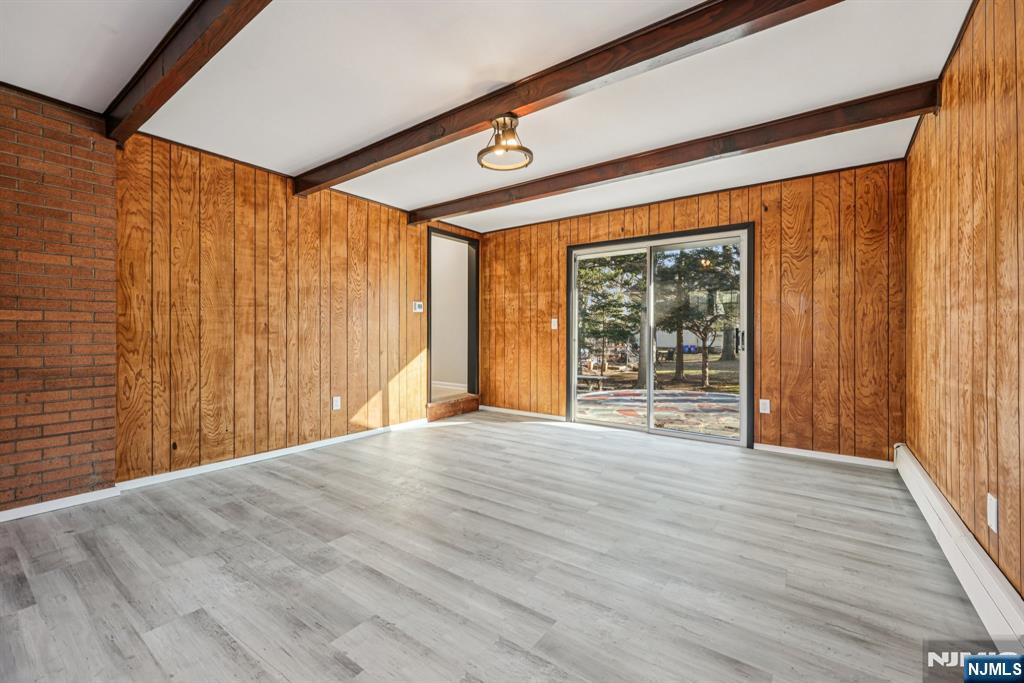 217 Knickerbocker Road Closter, NJ 07624 - Photo 13 of 27 a view of an empty room with wooden floor and a window