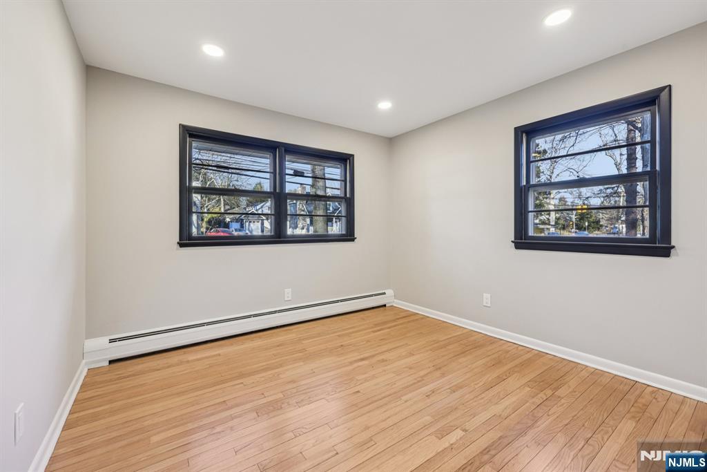 217 Knickerbocker Road Closter, NJ 07624 - Photo 15 of 27 a view of an empty room with wooden floor and a window