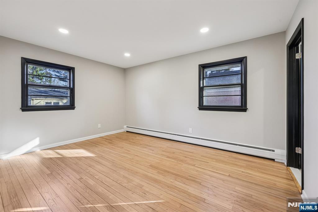 217 Knickerbocker Road Closter, NJ 07624 - Photo 17 of 27 a view of an empty room with wooden floor and a window
