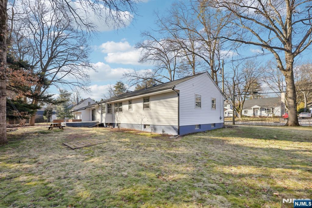 217 Knickerbocker Road Closter, NJ 07624 - Photo 27 of 27 a view of a yard with a large tree