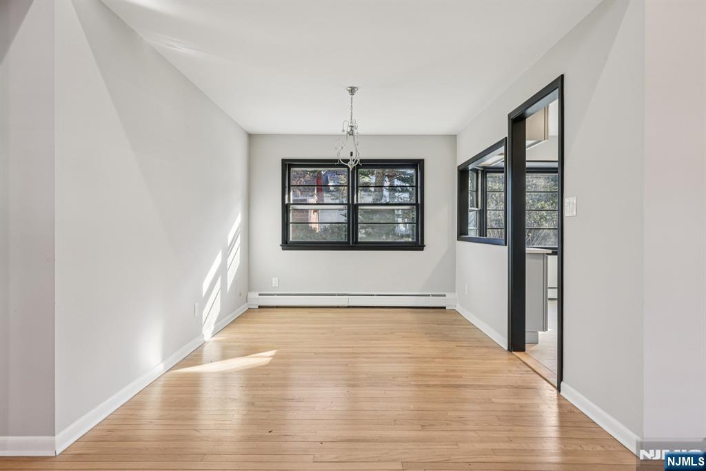 217 Knickerbocker Road Closter, NJ 07624 - Photo 7 of 27 a view of an empty room window and wooden floor