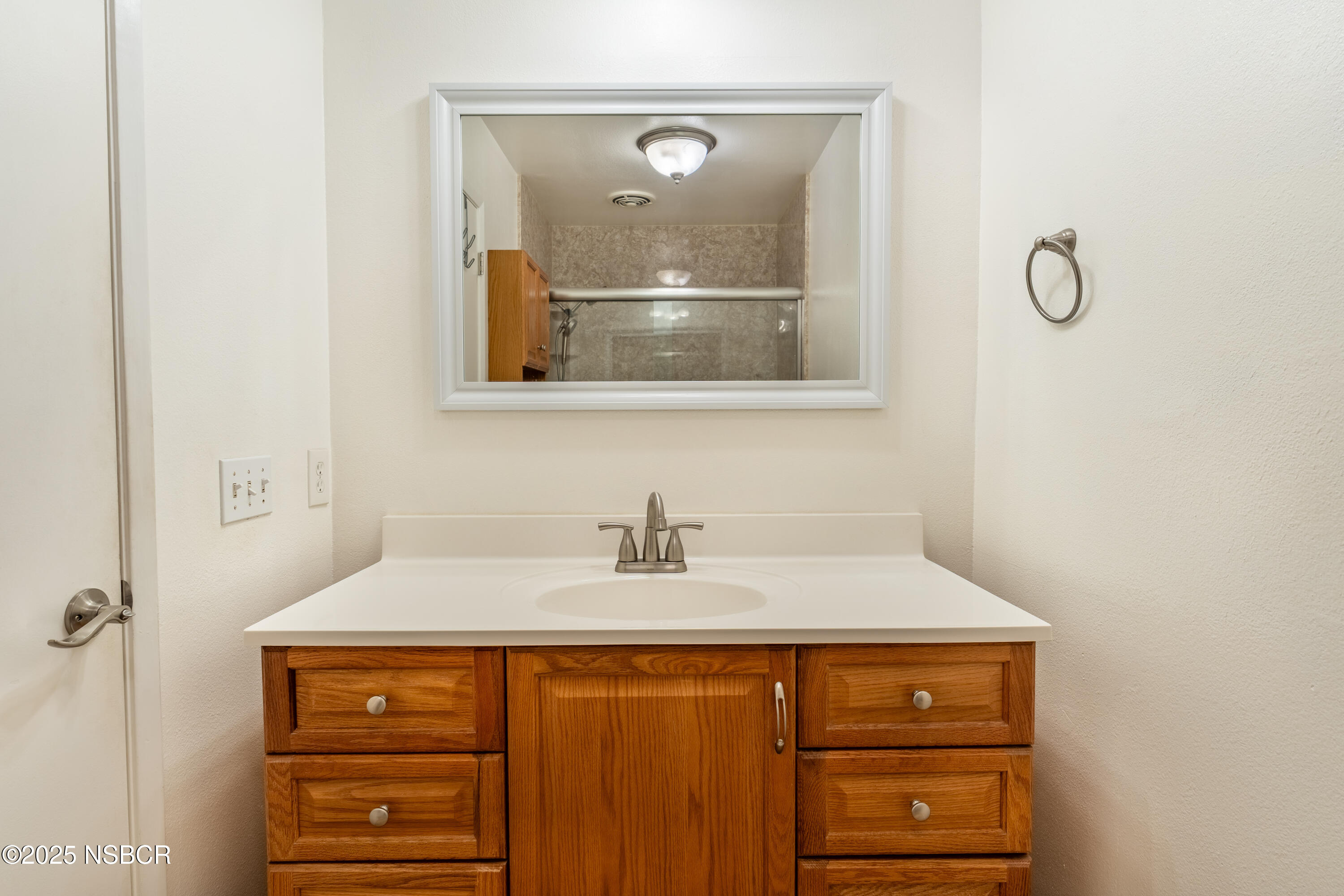 901 Arnold Avenue Lompoc, CA 93436 - Photo 14 of 21 a bathroom with a sink and a mirror