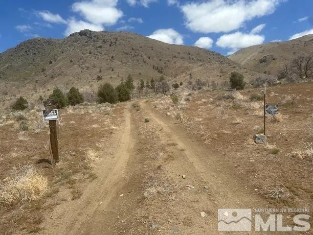 a view of a dry space with mountain view