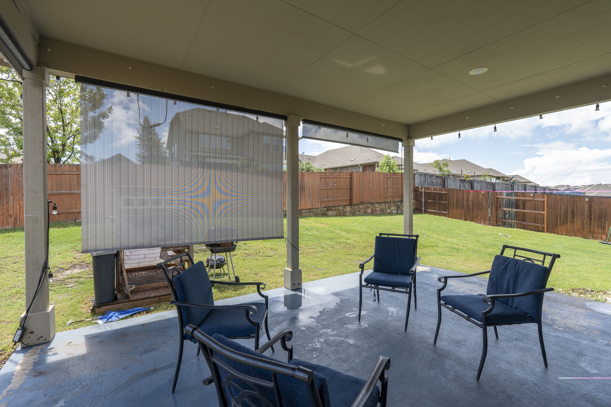 548 Purple Heart Drive Buda, TX 78610 - Photo 27 of 35 An inviting covered patio offers a comfortable outdoor living space with ample room for entertaining.