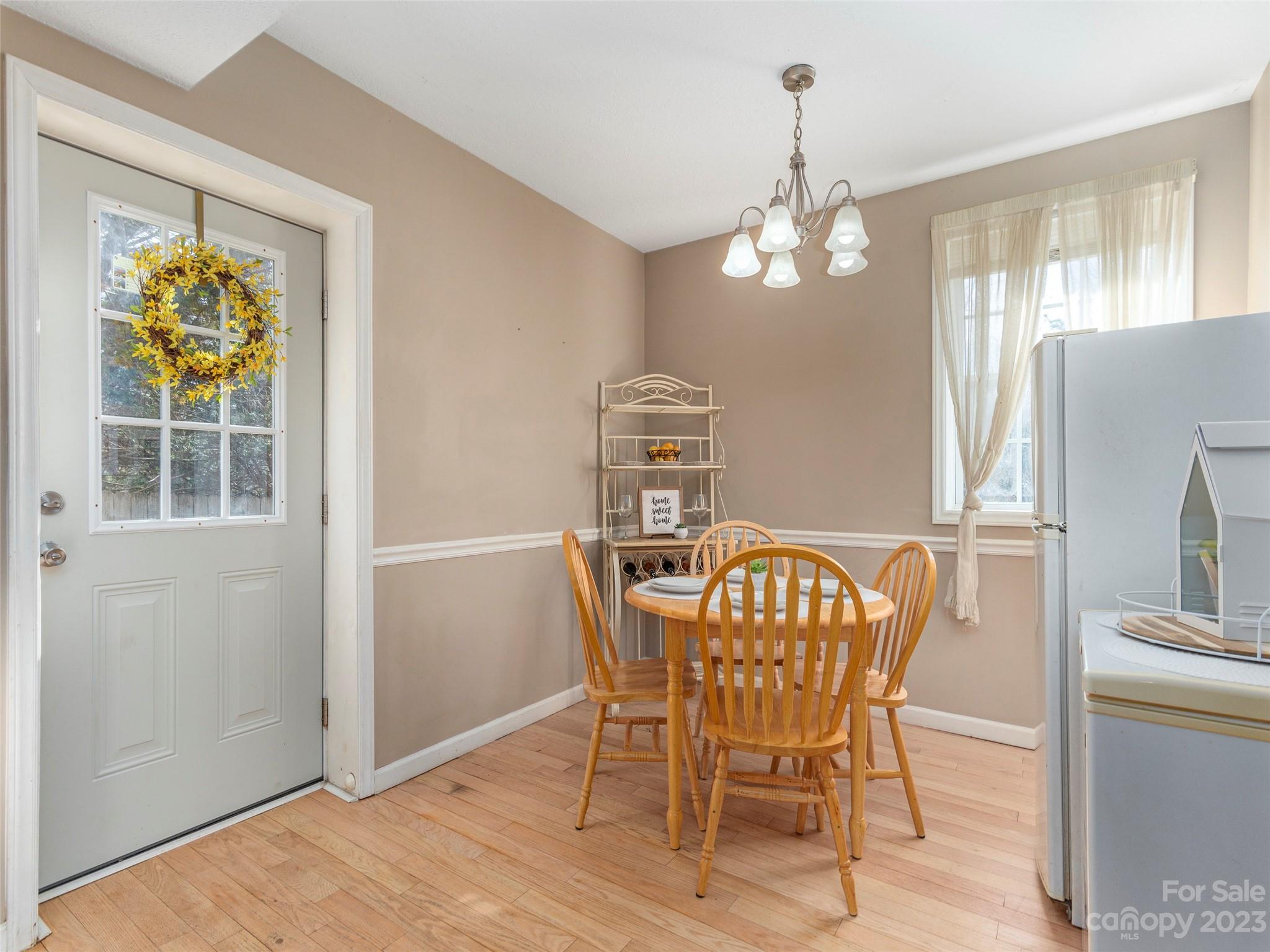 40 Laurel Loop Asheville, NC 28806 - Photo 11 of 26 a view of a dining room with furniture wooden floor and chandelier