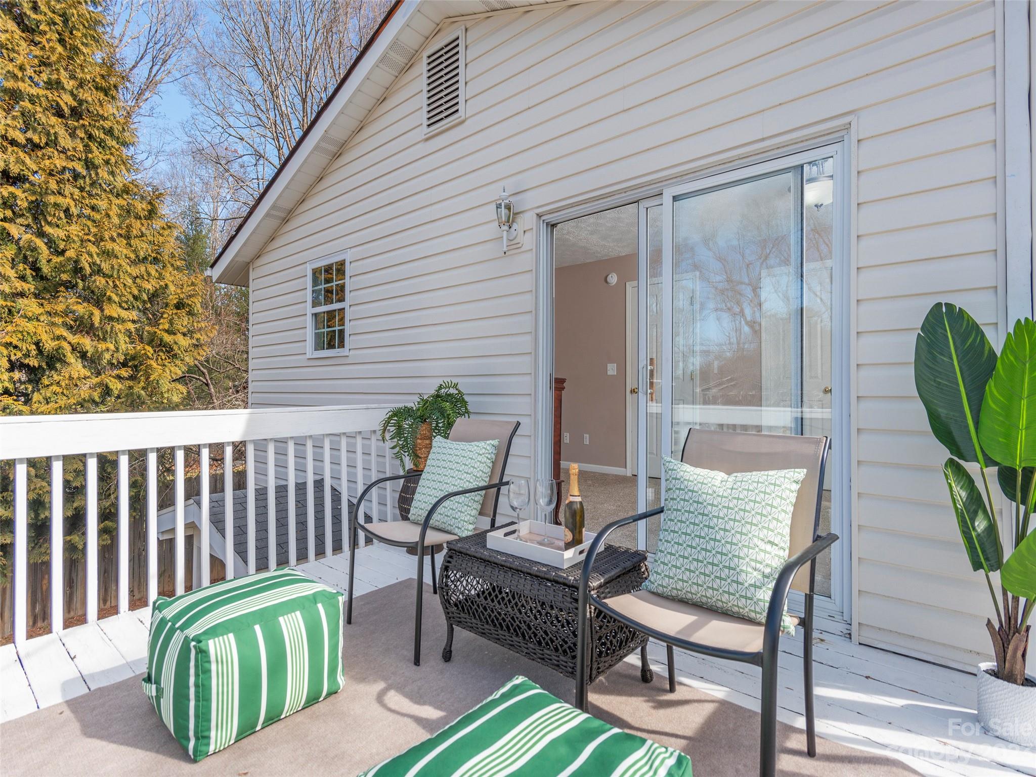 40 Laurel Loop Asheville, NC 28806 - Photo 15 of 26 a view of a two chairs in the porch