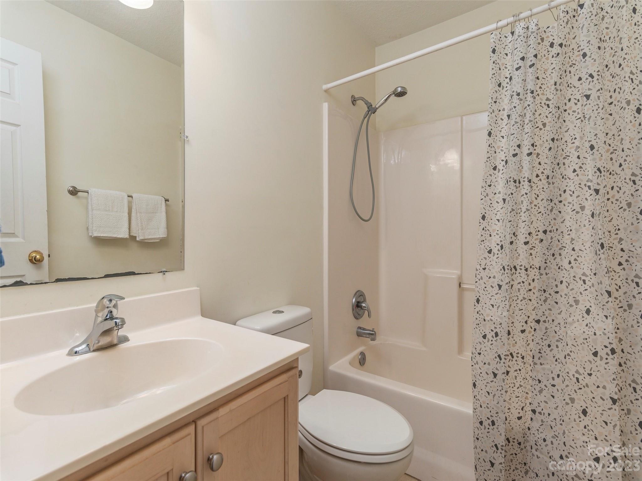 40 Laurel Loop Asheville, NC 28806 - Photo 21 of 26 a bathroom with a sink toilet and shower