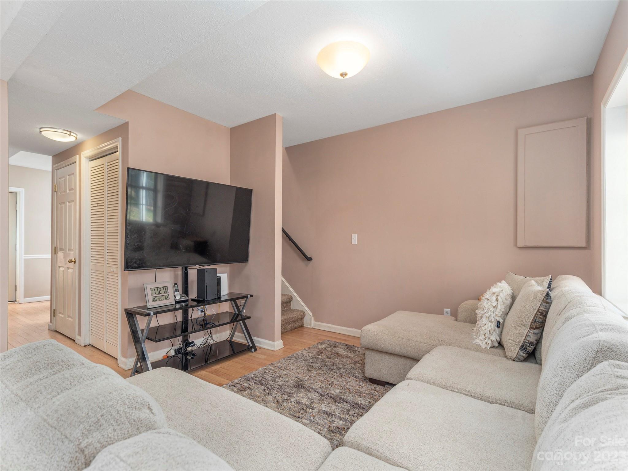 40 Laurel Loop Asheville, NC 28806 - Photo 4 of 26 a living room with furniture and a flat screen tv