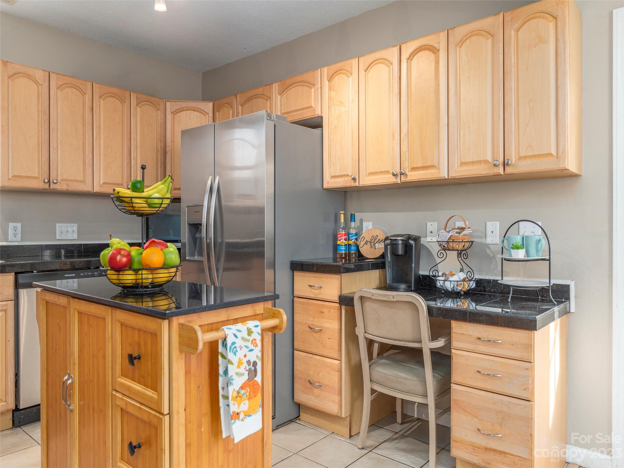 40 Laurel Loop Asheville, NC 28806 - Photo 9 of 26 a kitchen with stainless steel appliances granite countertop a refrigerator sink and cabinets
