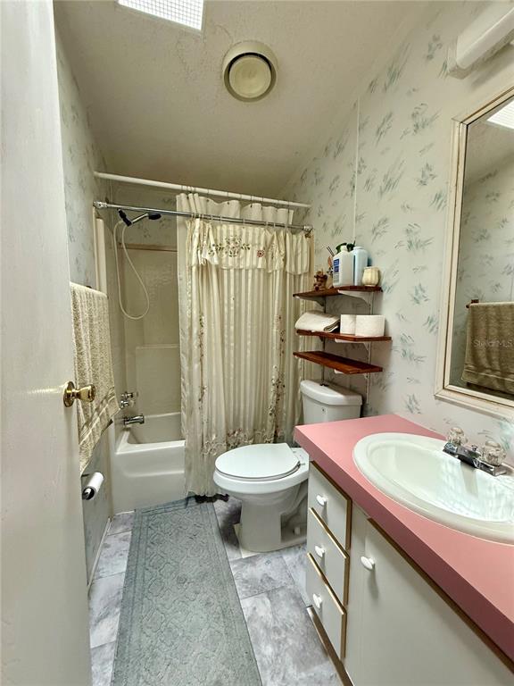 340 Debra Street Inglis, FL 34449 - Photo 19 of 29 a bathroom with a sink a toilet and shower