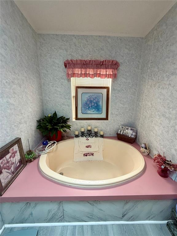340 Debra Street Inglis, FL 34449 - Photo 23 of 29 a bathroom with a sink and a mirror