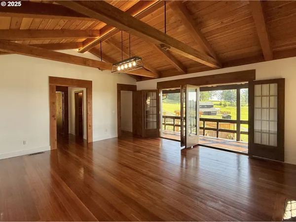 a balcony view with a sink and wooden floor