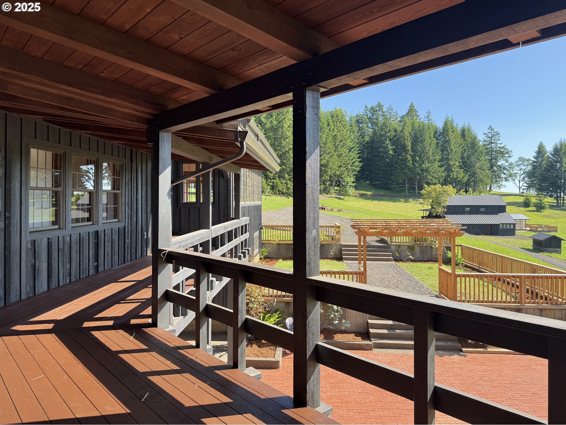 11890 Dupee Valley Road, Unit 1 Sheridan, OR 97378 - Photo 16 of 48 a view of a balcony with chairs and wooden floor