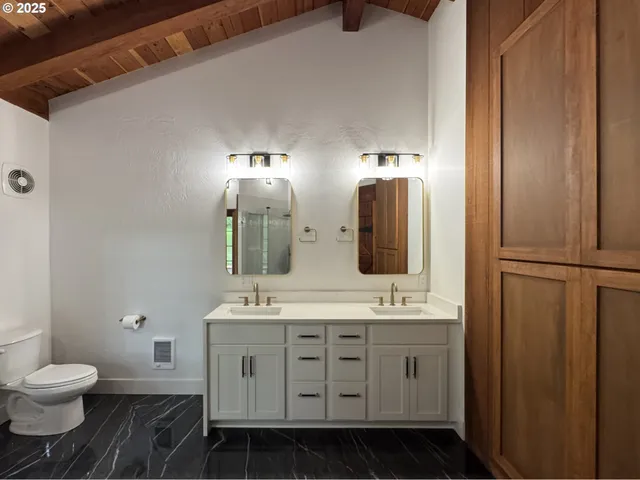 a bathroom with a bathtub and shower