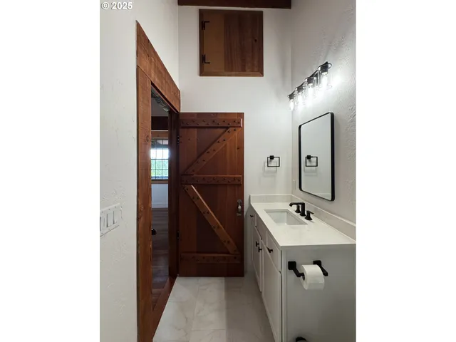 a view of a balcony with wooden floor