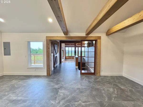 a view of livingroom with furniture and a window