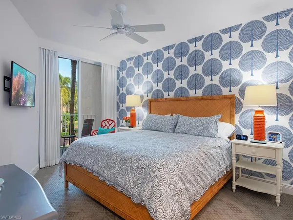 a bedroom with a bed and lamp