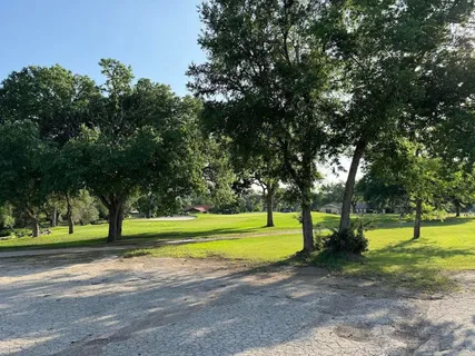 a view of a lake with a yard