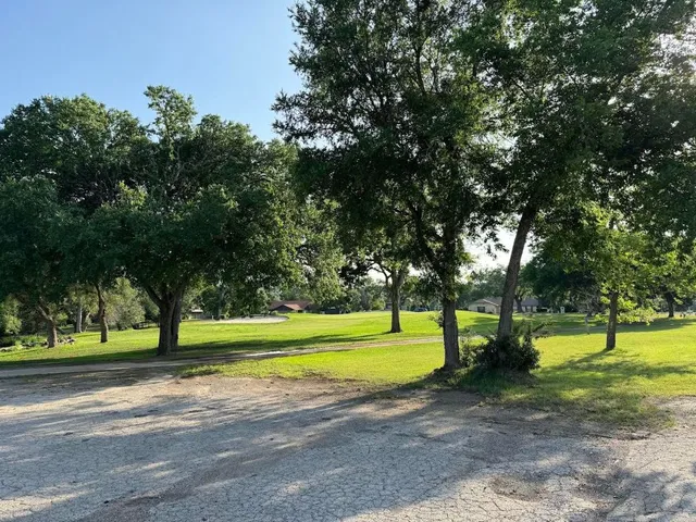 a view of a lake with a yard