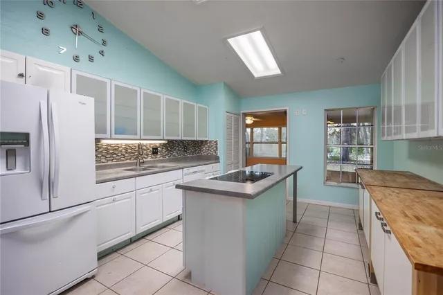 a kitchen with stainless steel appliances granite countertop a sink and cabinets