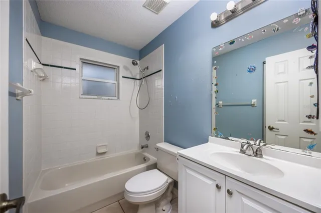 a bathroom with a sink toilet tub and shower
