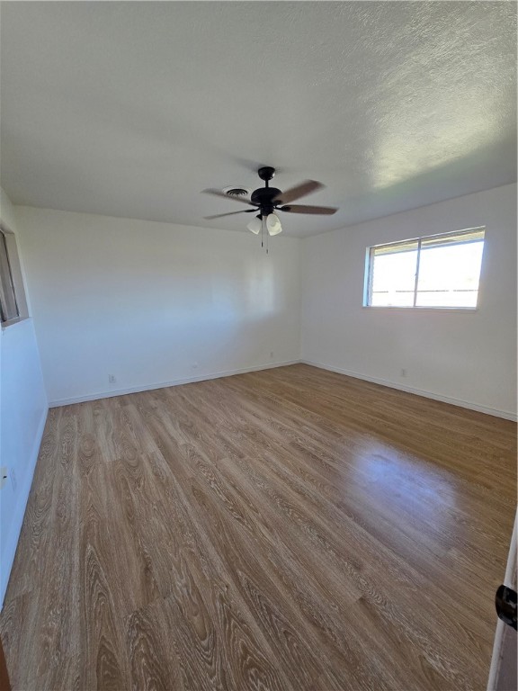 314 Saratoga Boulevard Corpus Christi, TX 78417 - Photo 7 of 16 wooden floor in an empty room with a window