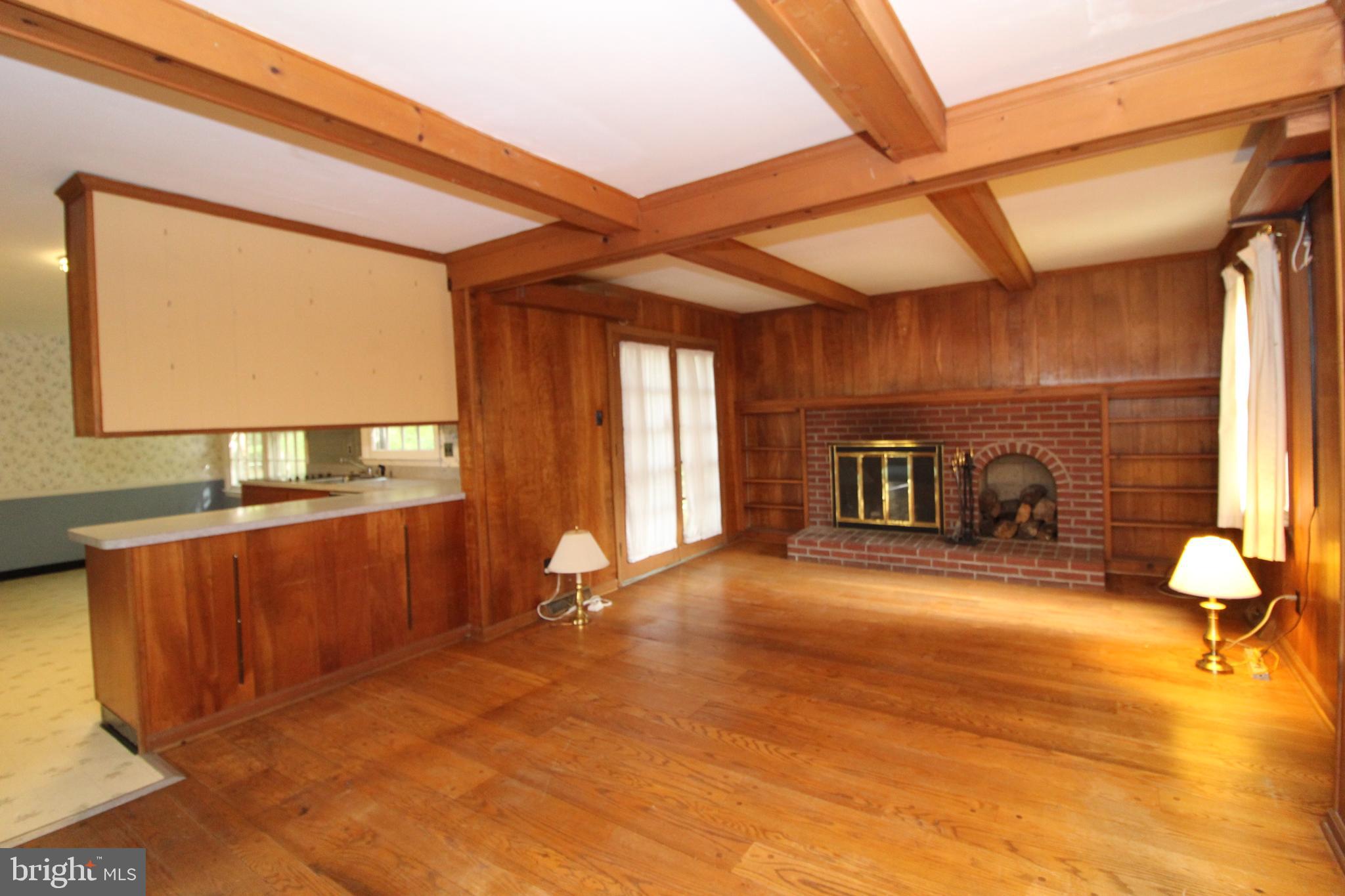 624 Halstead Road Wilmington, DE 19803 - Photo 5 of 20 Family Room with Fireplace open to Kitchen & Patio