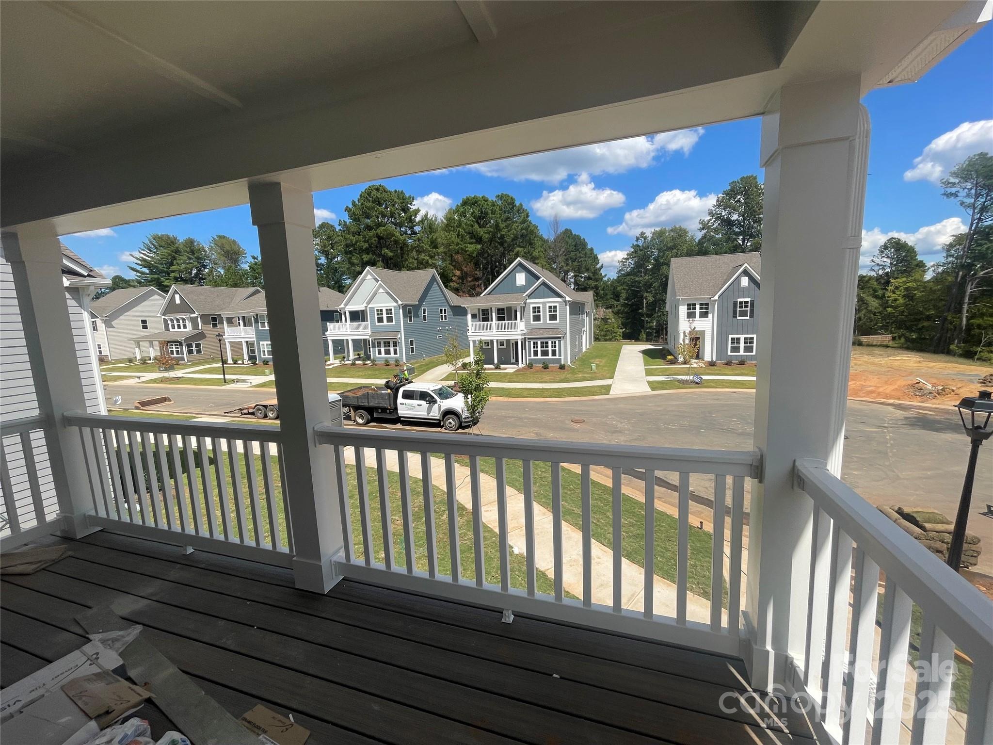 4044 Grommet Court Matthews, NC 28105 - Photo 12 of 27 a view of a house with a porch and wooden floor