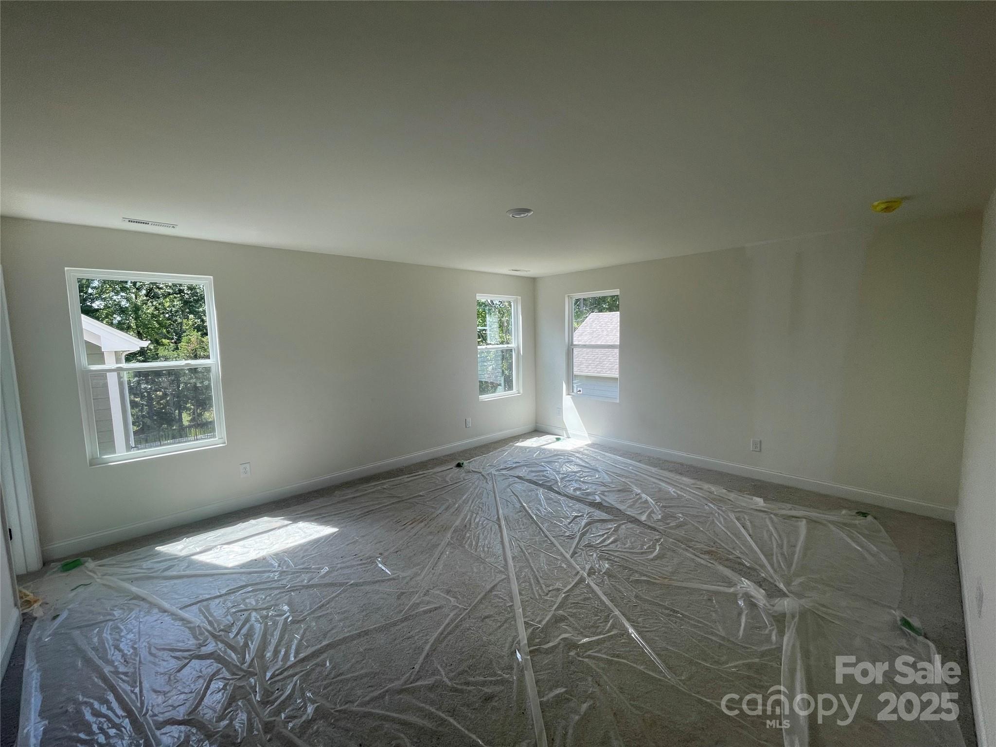 4044 Grommet Court Matthews, NC 28105 - Photo 22 of 27 a view of empty room with windows
