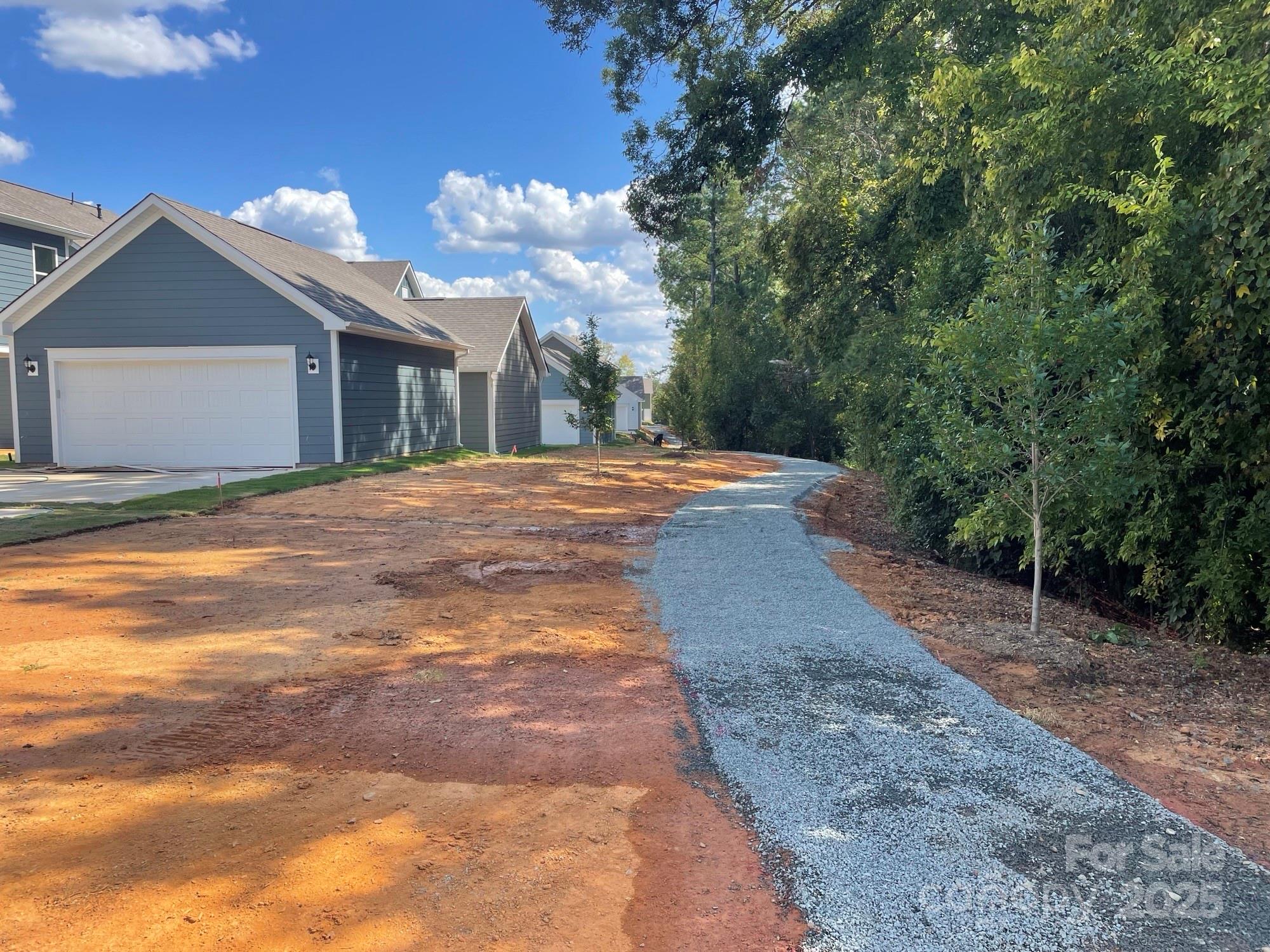 4044 Grommet Court Matthews, NC 28105 - Photo 25 of 27 a view of a house with a yard