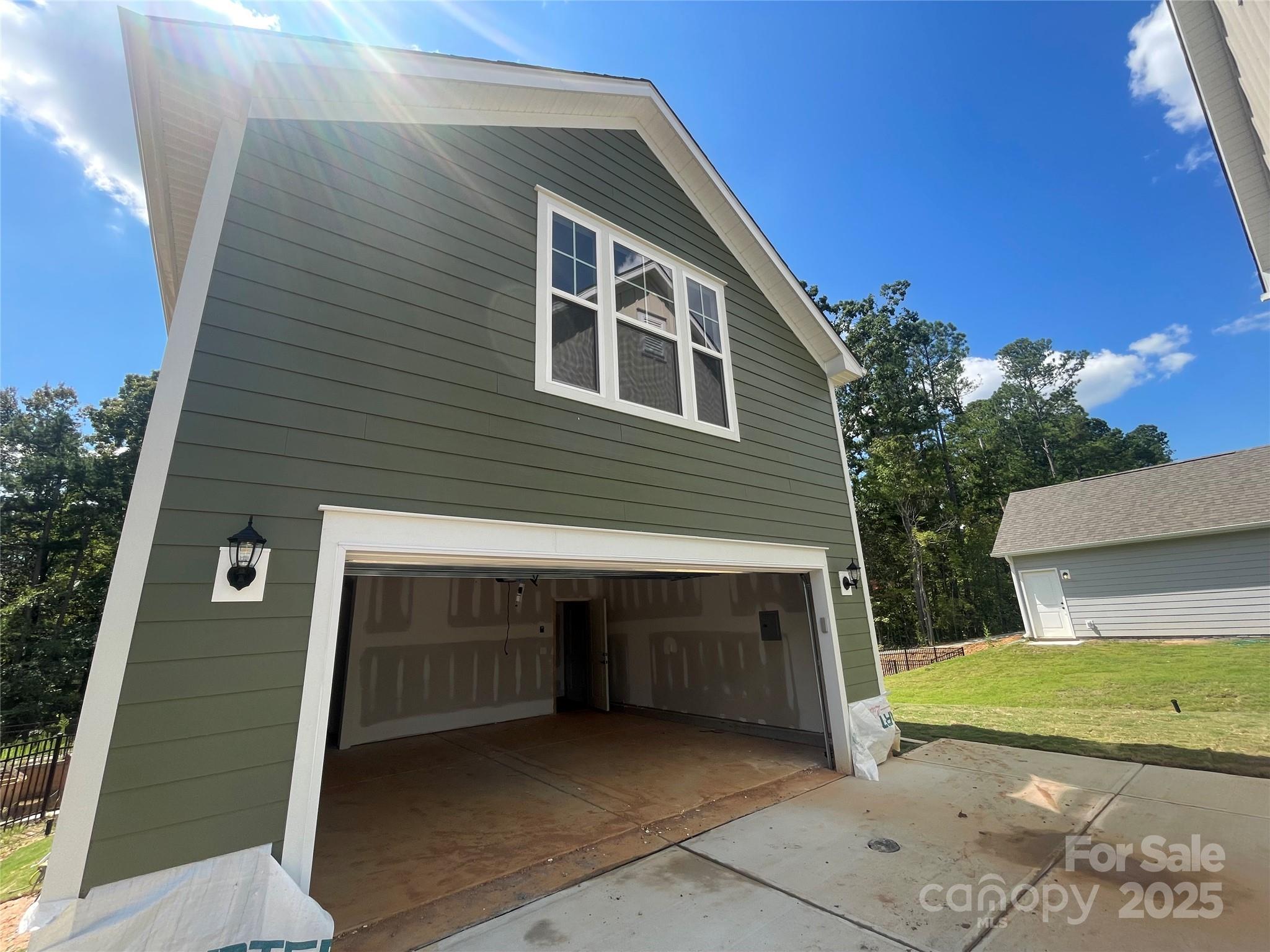 4044 Grommet Court Matthews, NC 28105 - Photo 9 of 27 a front view of a house with garage